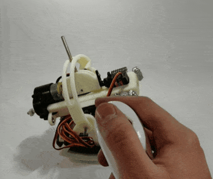 A Gif of a hacked wii nunchuck being used to move a robot prototype